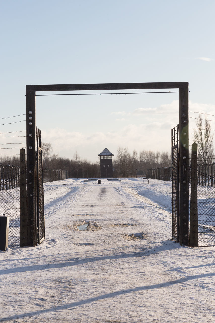 SNOW COVERED FIELD AGAINST CLEAR SKY DURING WINTER