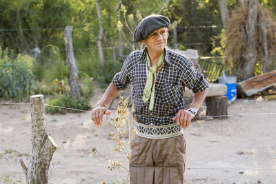 Farmer standing at farm