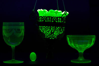 Close-up of wine glass on table against black background