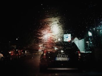 City street seen through wet glass window