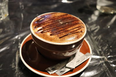 Close-up of coffee cup on table