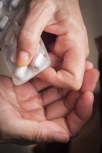 Close-up of man holding hands