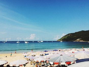 Scenic view of beach against blue sky