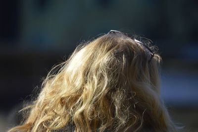 Close-up portrait of woman against blurred background