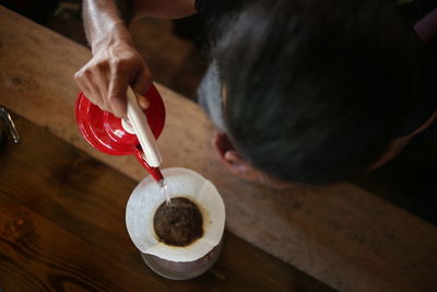 High angle view of woman holding ice cream