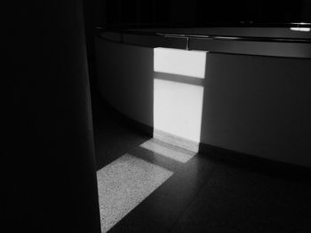 High angle view of sunlight falling on tiled floor at home