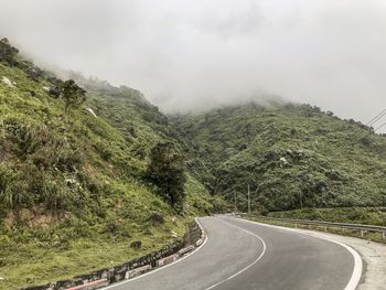 Scenic view of mountain road against sky