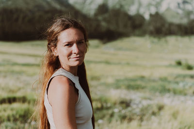 Young woman standing on field