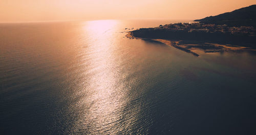 Scenic view of sea against sky at sunset