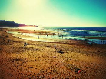 Scenic view of beach against blue sky