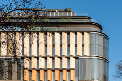 Low angle view of building against clear blue sky