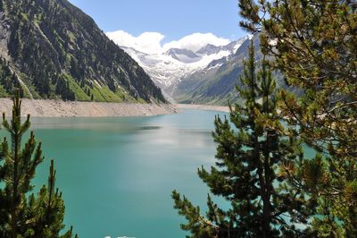 Scenic view of lake and mountains against sky