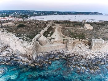 Aerial view of landscape and sea against sky