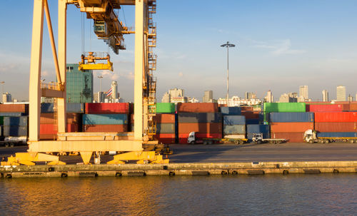 Commercial dock by pier against sky