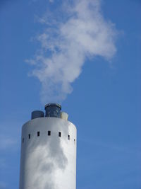 Low angle view of smoke stack against sky