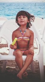 Portrait of woman sitting in water