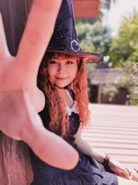 Portrait of a smiling girl wearing hat