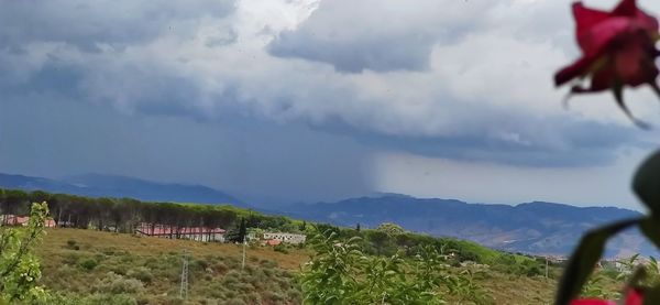 Panoramic view of land and mountains against sky