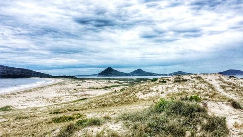 Scenic view of sea against cloudy sky