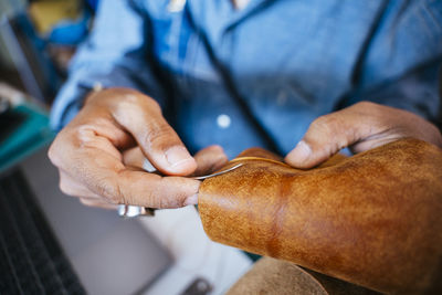 Midsection of people working in workshop