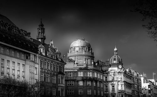 Low angle view of buildings in city against sky