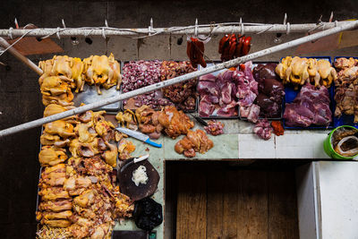 Various fruits hanging on barbecue grill