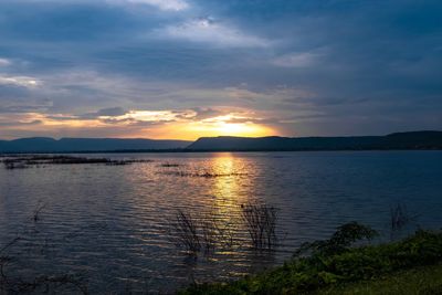 Scenic view of lake against sky during sunset