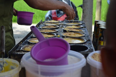 Close-up of man working street food