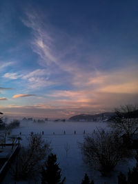 Scenic view of lake during sunset