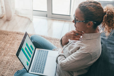 Man using laptop at home