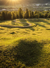 Scenic view of golf course against sky