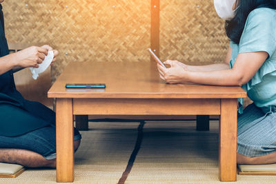 People sitting on table at home