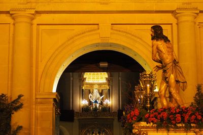 Statue in illuminated building