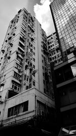 Low angle view of buildings in city against sky