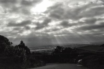 Scenic view of landscape against cloudy sky