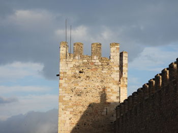 Low angle view of narrow alley amidst buildings in the  medieval city of montblanc