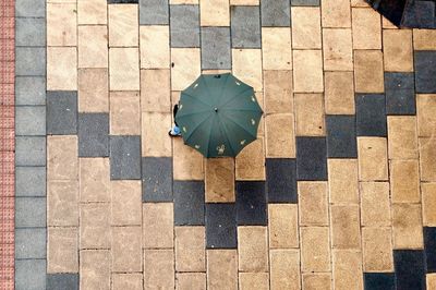 High angle view of stones on tiled floor