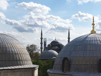 View of buildings in city against sky