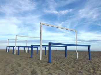 Lifeguard hut on beach against sky