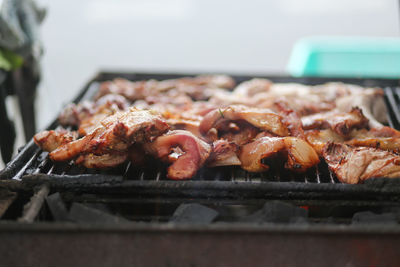 Pork pieces grilled on street charcoal grills in the street