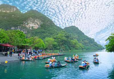 Group of people on boats in water