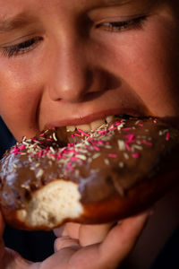 Close-up of woman eating ice cream