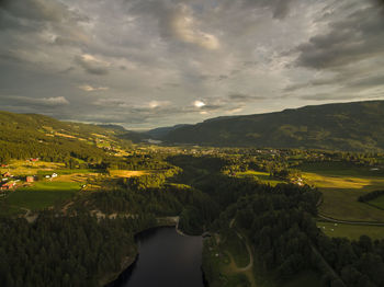 Scenic view of landscape with mountain range in background