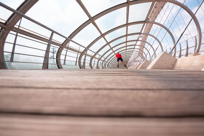 Athlete ski rolling on bridge