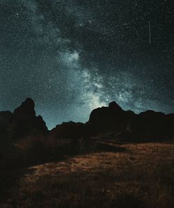 Scenic view of mountains against sky at night