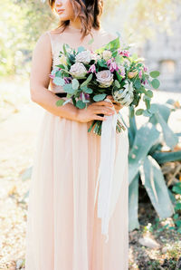 Young woman holding bouquet