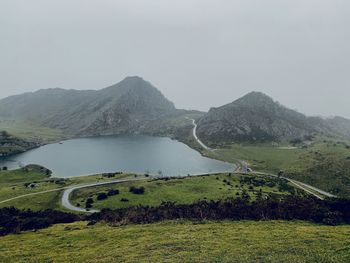Scenic view of landscape and mountains against sky