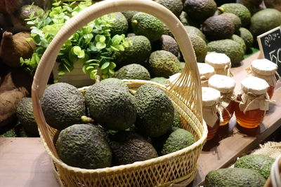 Various fruits in basket for sale at market stall