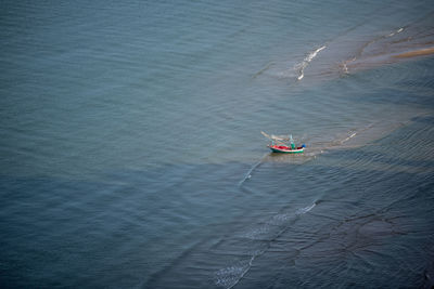High angle view of man on boat in sea