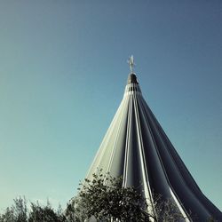 Low angle view of built structure against clear blue sky